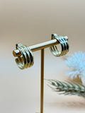 Classic vintage Monet gold tone hoop earrings with comfortable clip-on backs and a polished finish.