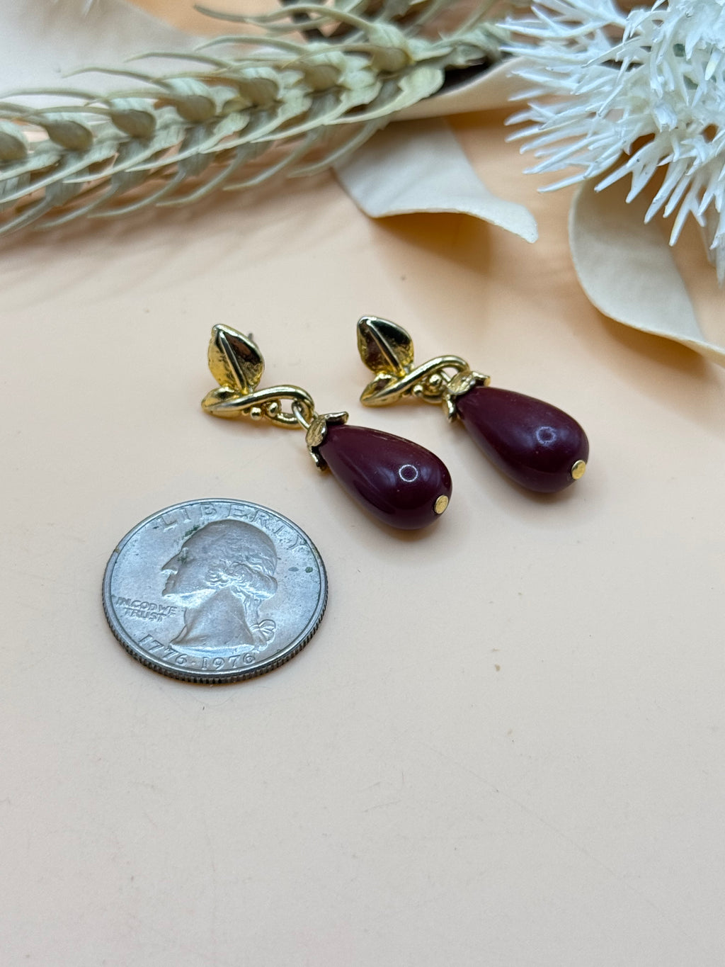 Burgundy Teardrop Dangle Earrings with Gold Tone Leaf Design