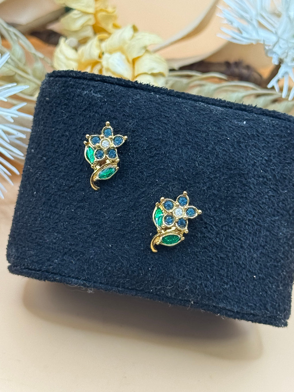 Avon Gold Tone Blue Rhinestone Flower Stud Earrings Green Enamel Leaves