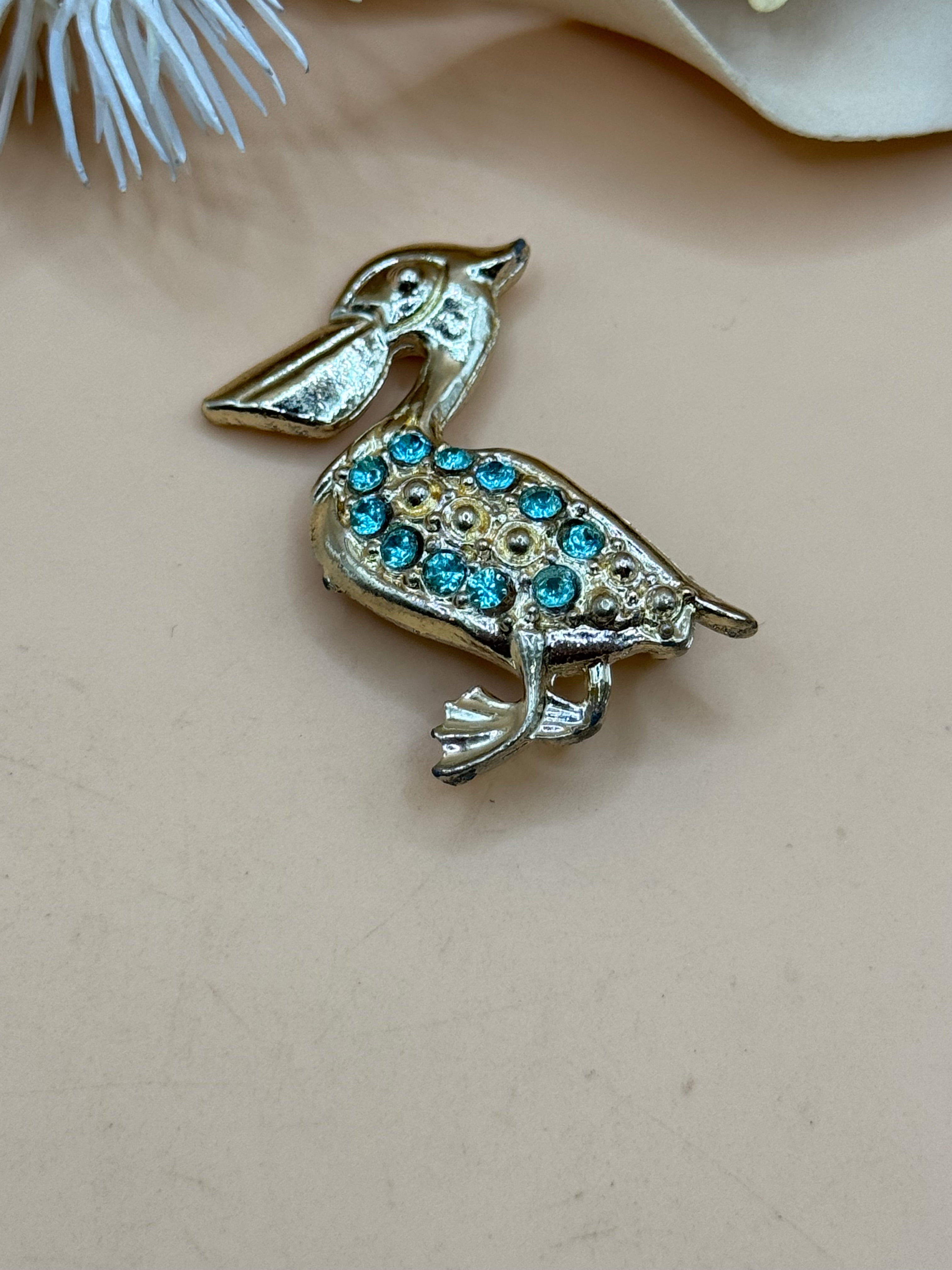 Gold Tone Pelican Bird Brooch Blue Rhinestone Figural Pin